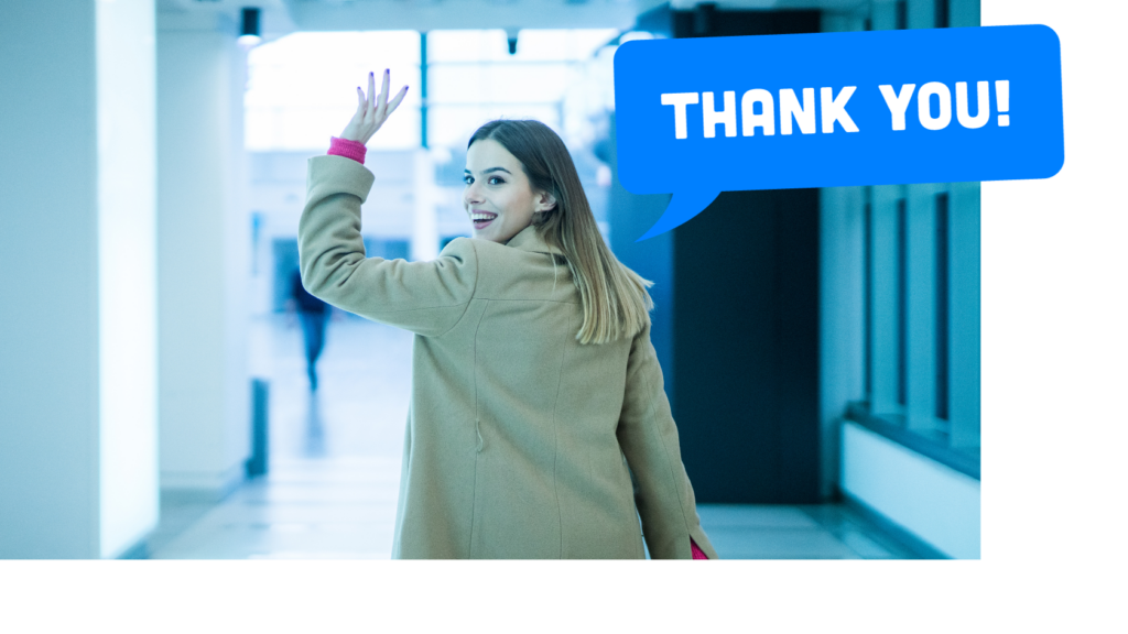 How Much Does SEO Cost in 2024?Friendly woman with long brown hair waving goodbye while standing in front of a blue background. She has a warm smile on her face, wearing a brown blazer over a pink blouse. This photo conveys appreciation and an enthusiastic farewell, closing out the article with positive regards towards the reader.